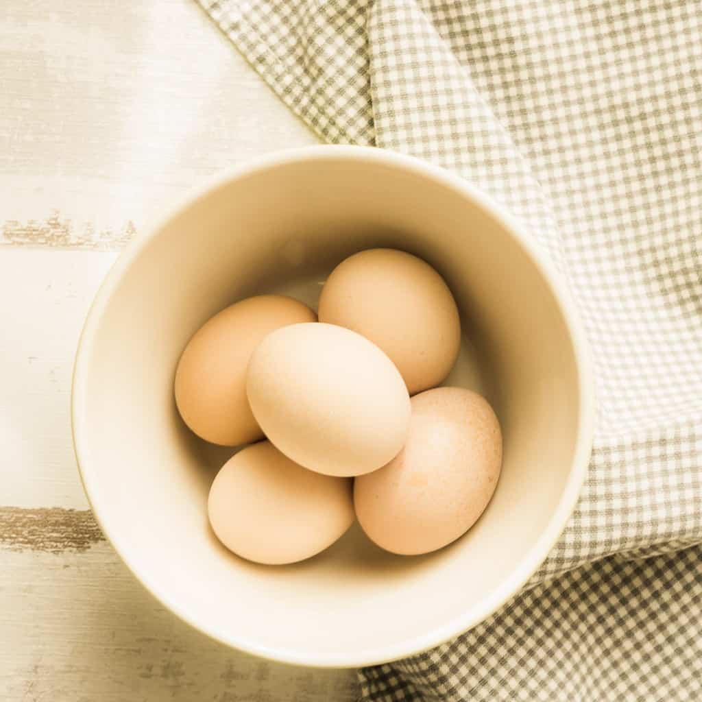 brown eggs in small bowl