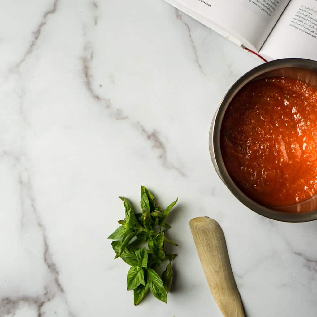 marble counter with pan and wooden spoon