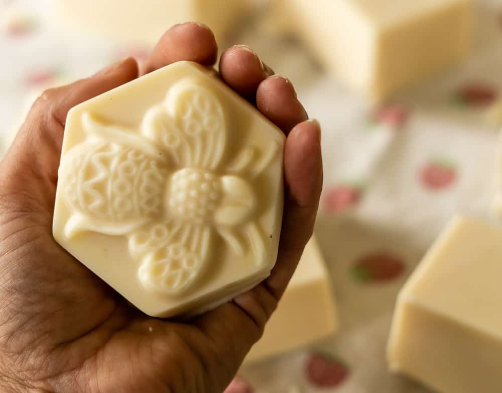 bar of beeswax and honey soap with bee design