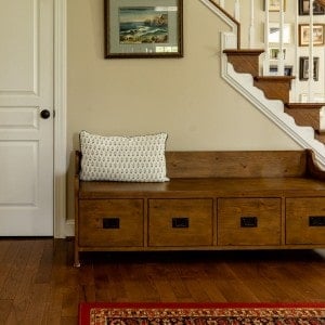 wooden bench in front of stairs