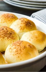 garlic rolls in round white baking dish