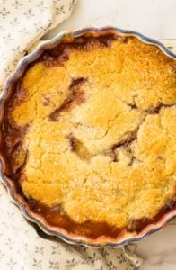 plum cobbler on white surface
