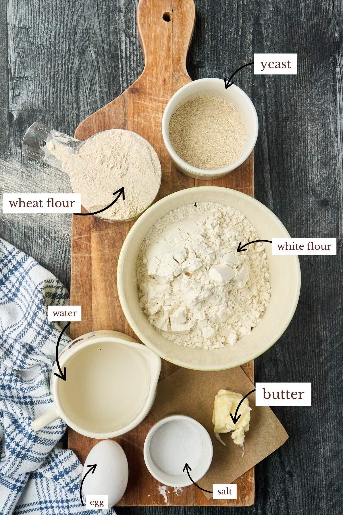 labeled ingredients on wooden counter.