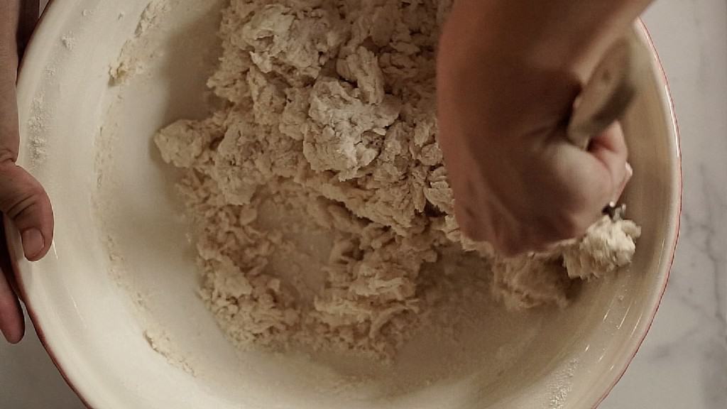 dry crumbly bread dough being mixed
