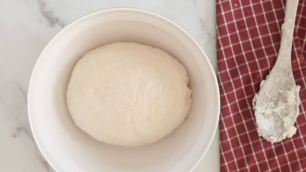 sourdough pizza dough mixing bowl waiting to rise
