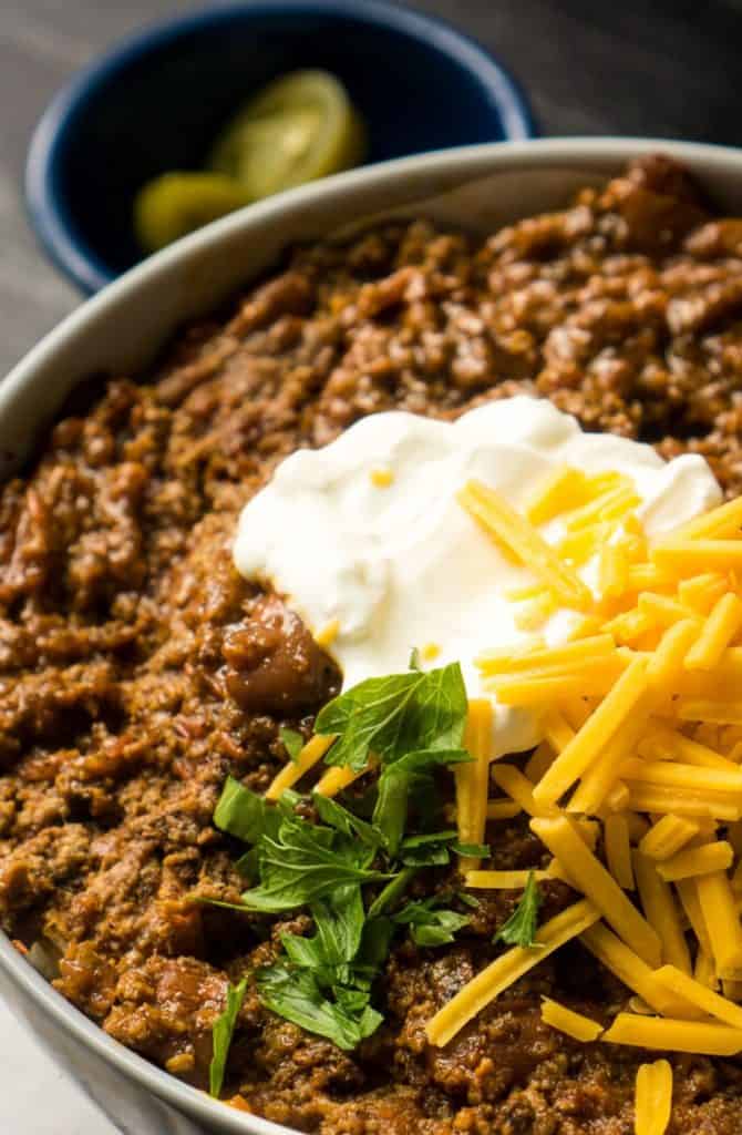 bowl of red chili in white bowl