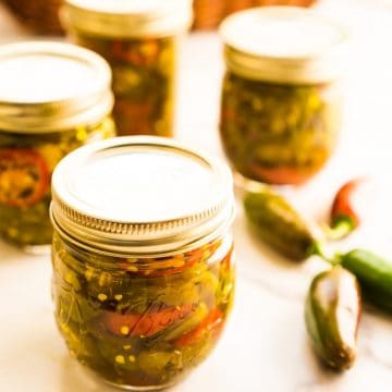 canned cowboy candy in mason jars in marble counter