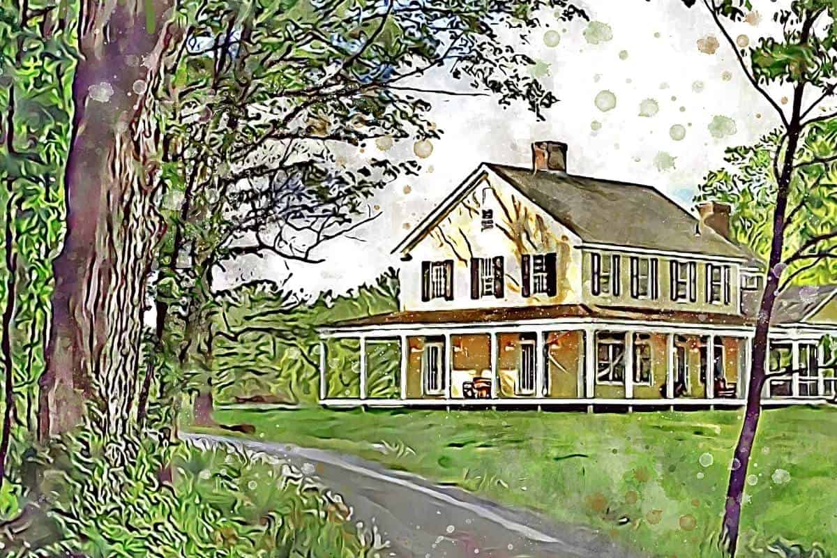 yellow two story farmhouse with winding driveway