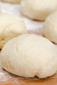 3 balls of homemade dough topped with flour