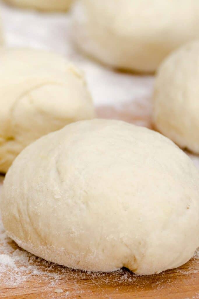 3 balls of homemade dough topped with flour