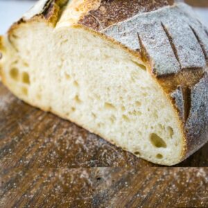 cut sourdough loaf on board