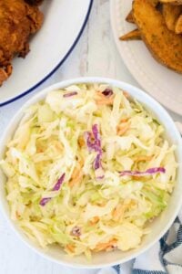 finished coleslaw in small white bowl