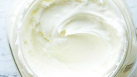 jar of cream on white wood surface