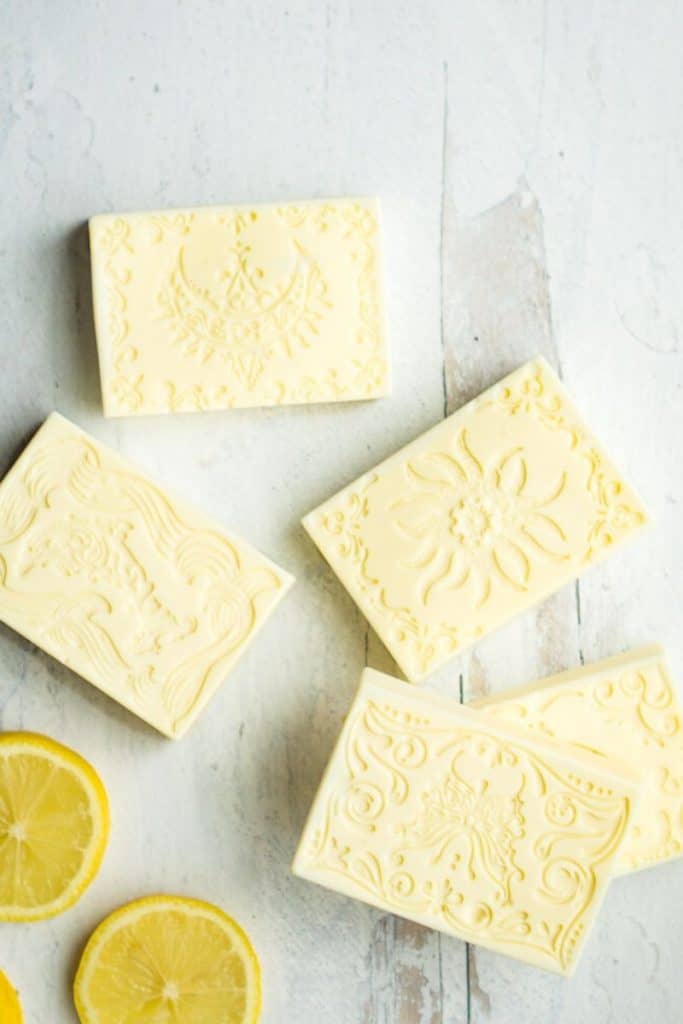 5 bars of homemade dish soap next to lemons