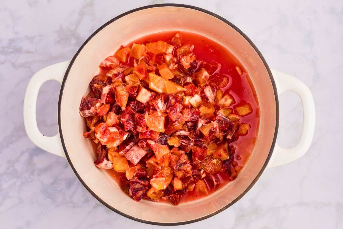 oranges chopped and placed in pot.