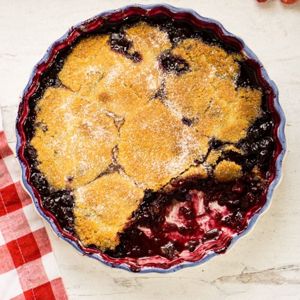 triple berry cobbler in round dish