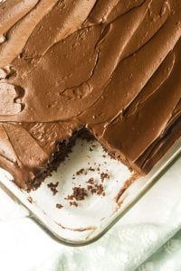 sourdough chocolate cake with icing with slice cut out