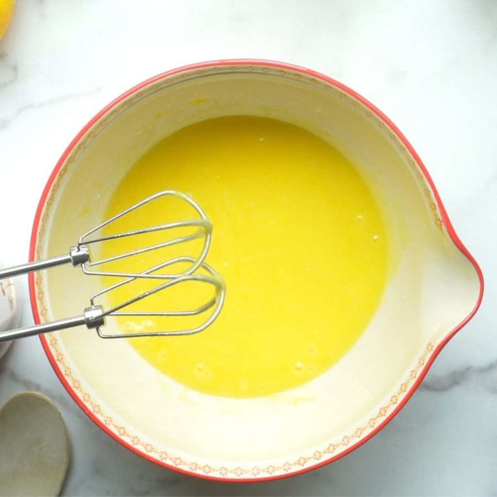 large mixing bowl with oil, eggs, sugar