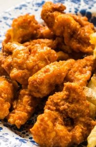 buffalo chicken tenders on blue and white plate