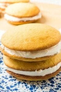 2 vanilla Whoopie Pies with cream filling on plate