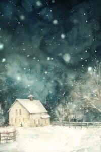 small white cottage on a snowy night.