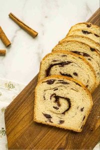 6 slices of bread next to cinnamon sticks