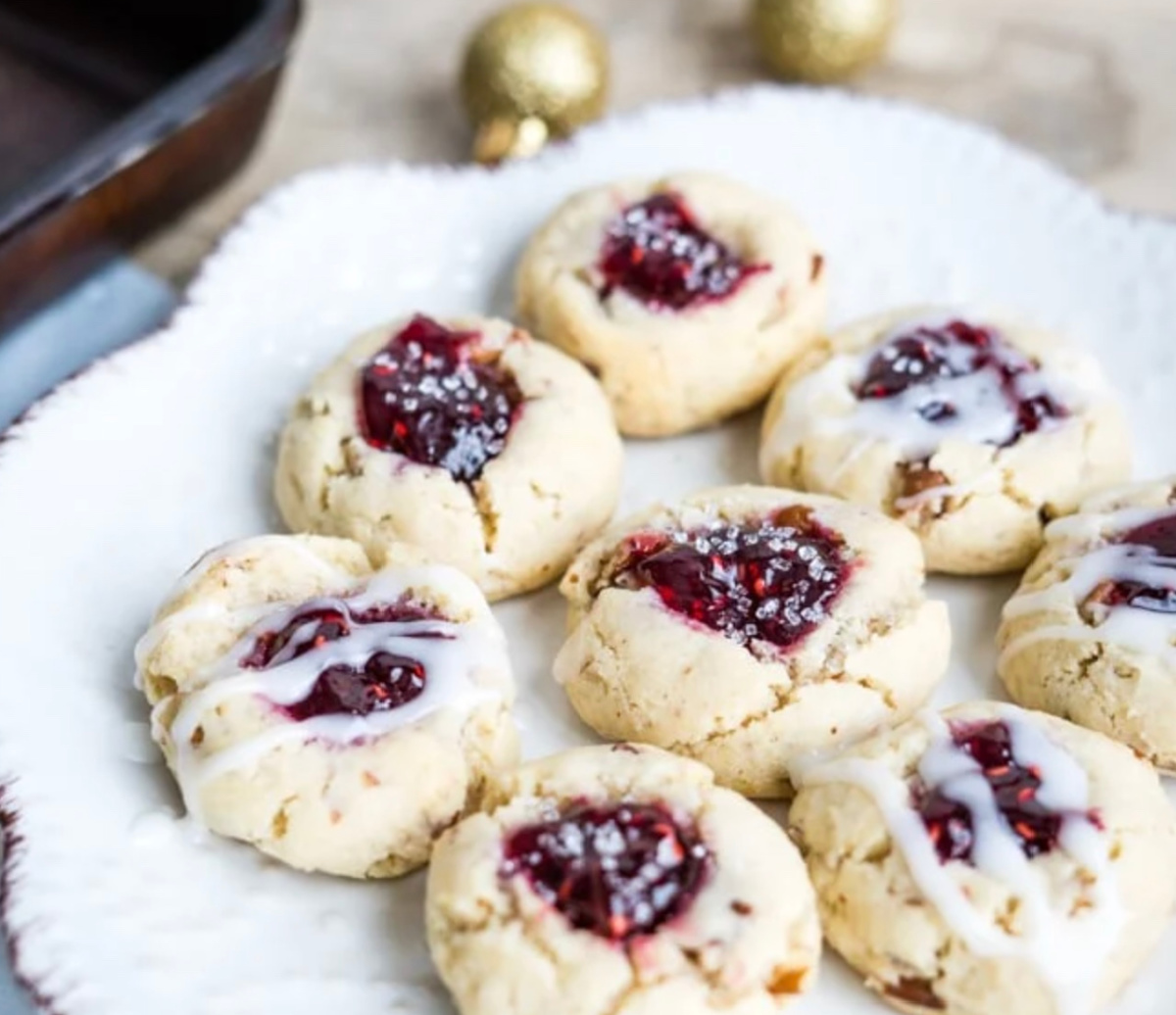 jam thumbprint cookies on white plate