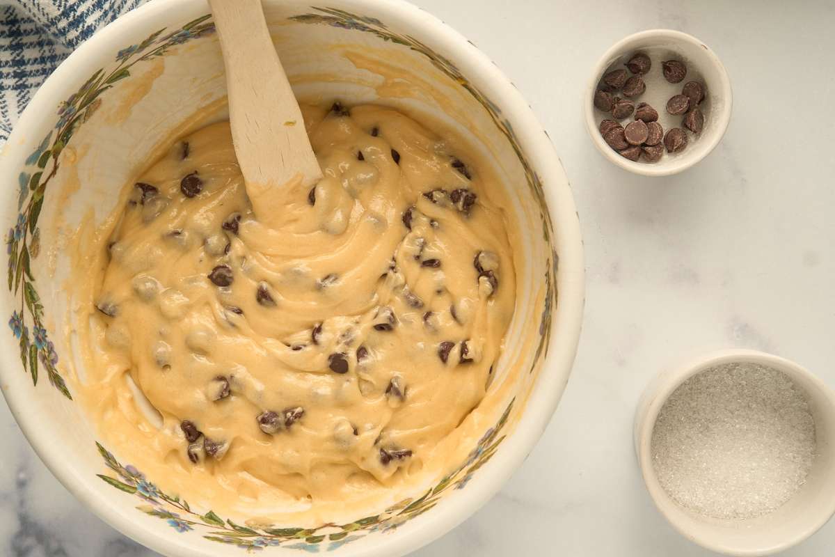 Bowl of thick muffin batter with chocolate chips.