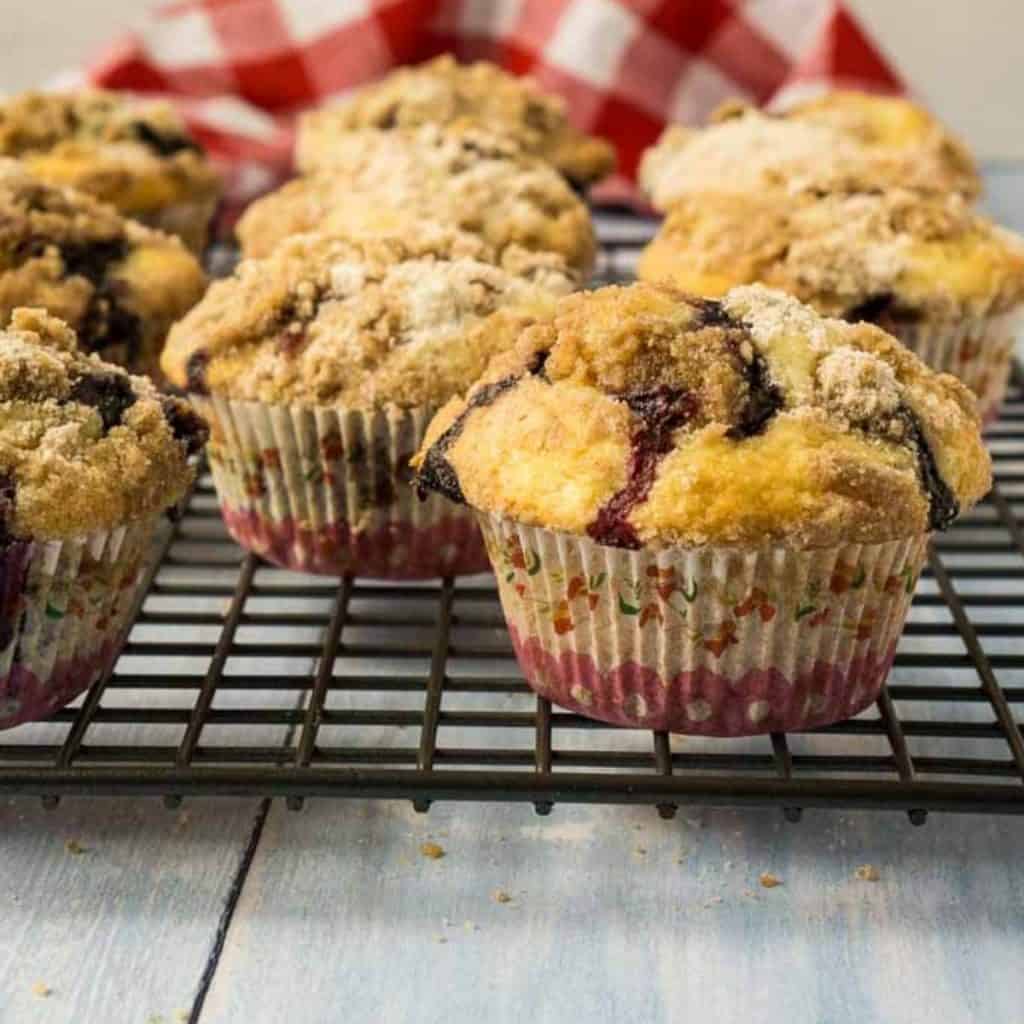 7 sourdough blueberry muffins on cooling rack