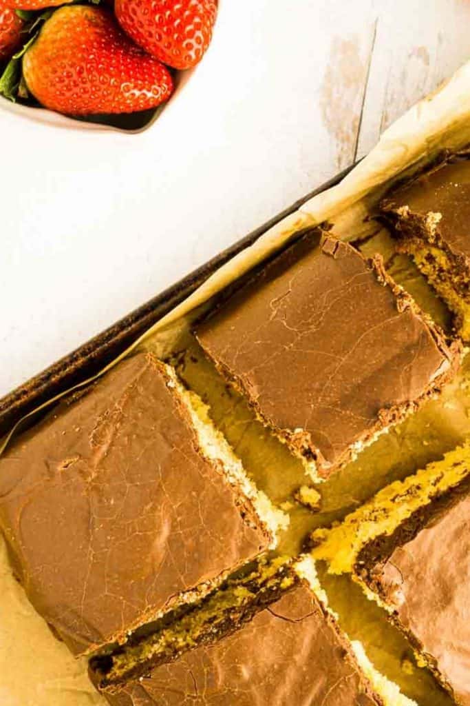 farrmer's daughter cake cut into squares on baking tin