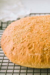 finished loaf of muffuletta bread on cooling rack.