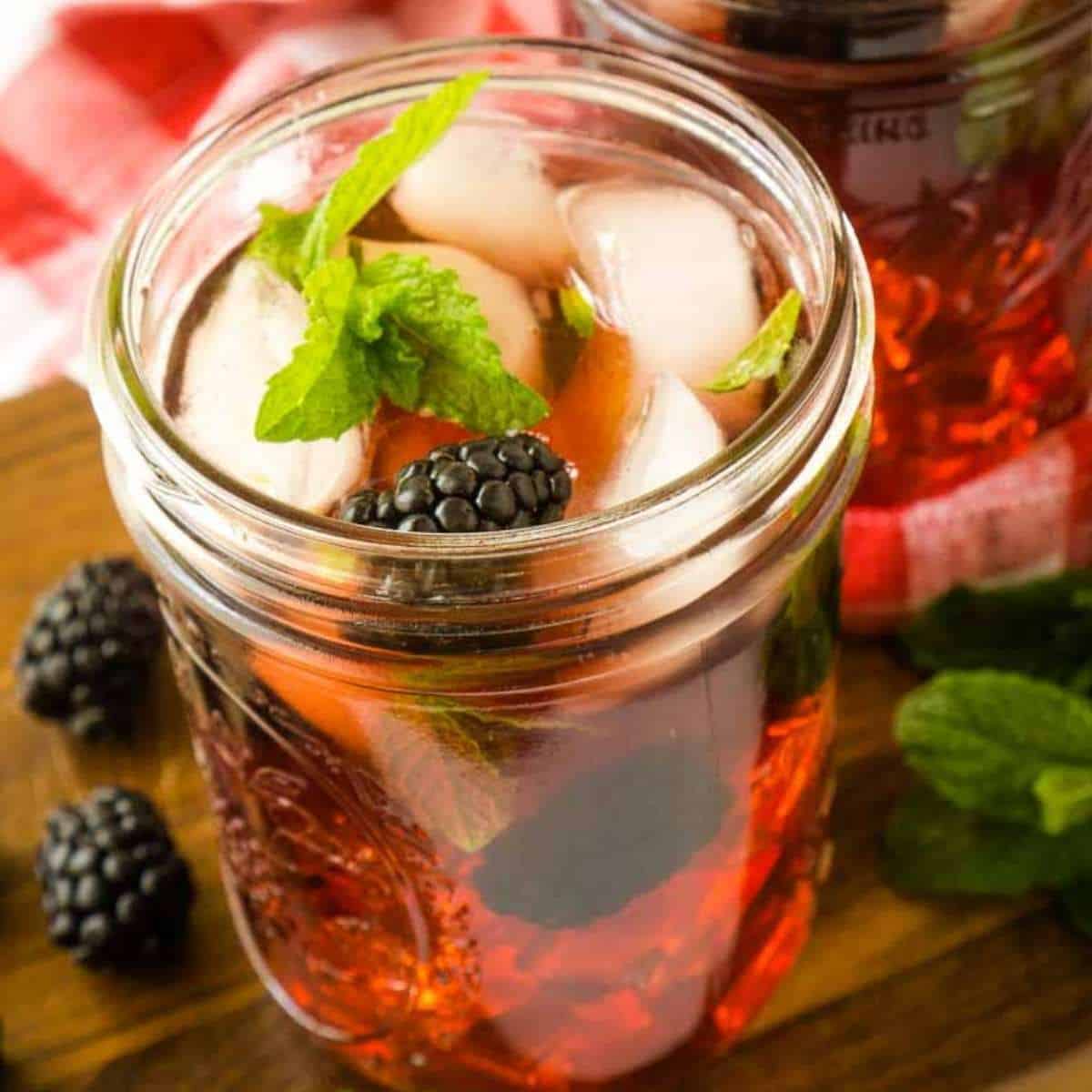 close up view of glass of blackberry sweet tea