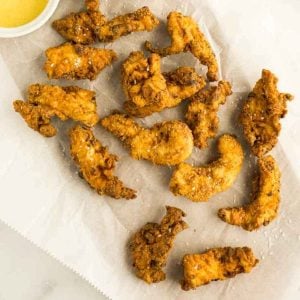 chicken tenders on parchment paper