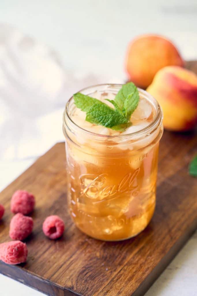 wide mouth mason jar with peach iced tea