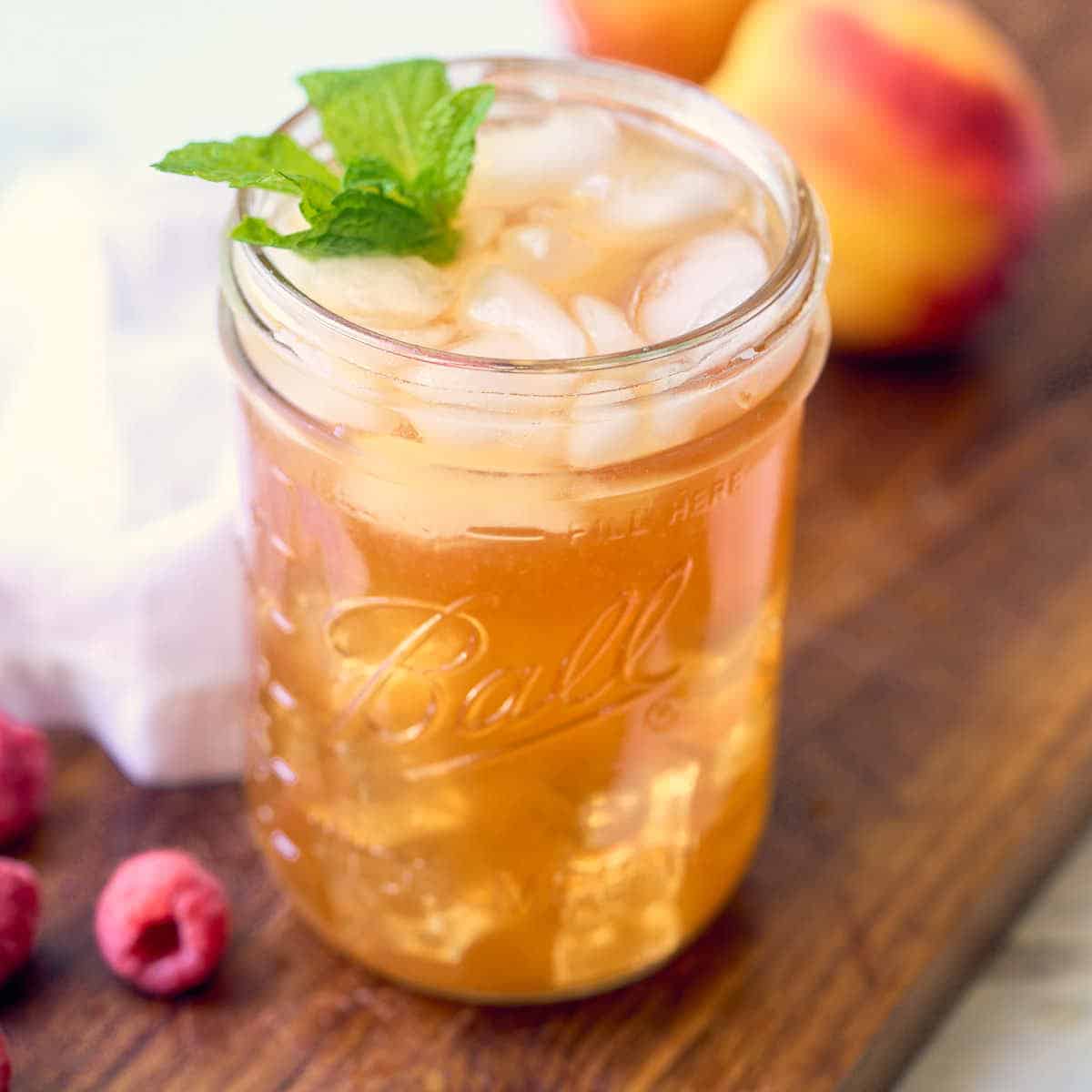 close up view of peach raspberry iced tea