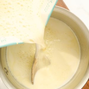 pouring egg mixture into milk mixture
