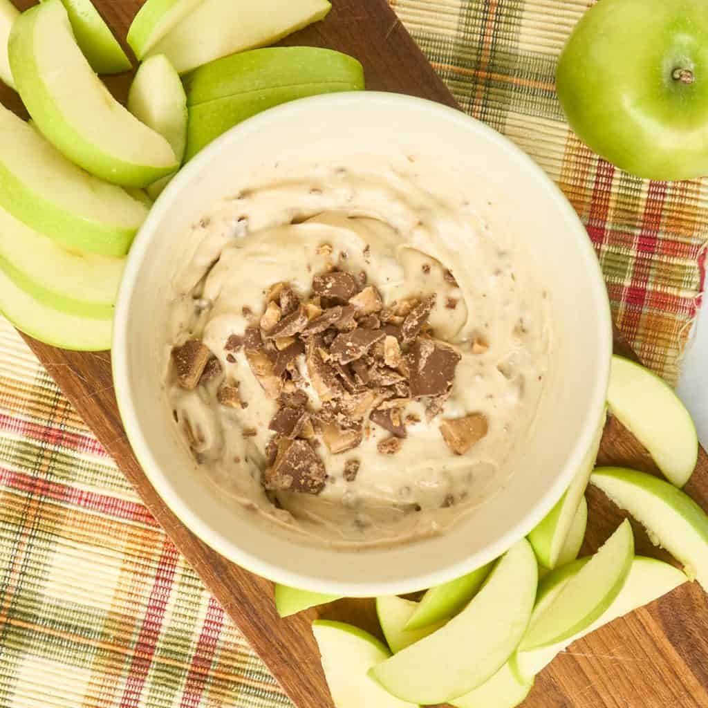 finished fruit dip surrounded by apple slices