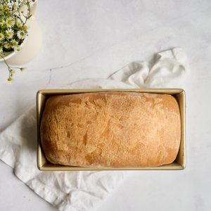 baked loaf of sandwich bread in pan