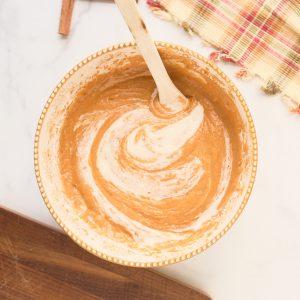 sourdouugh starter being mixed into pumpkin cake