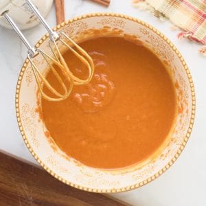 mixing bowl with caned pumpkin and sugar