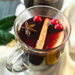 2 clear mugs with mulled wine