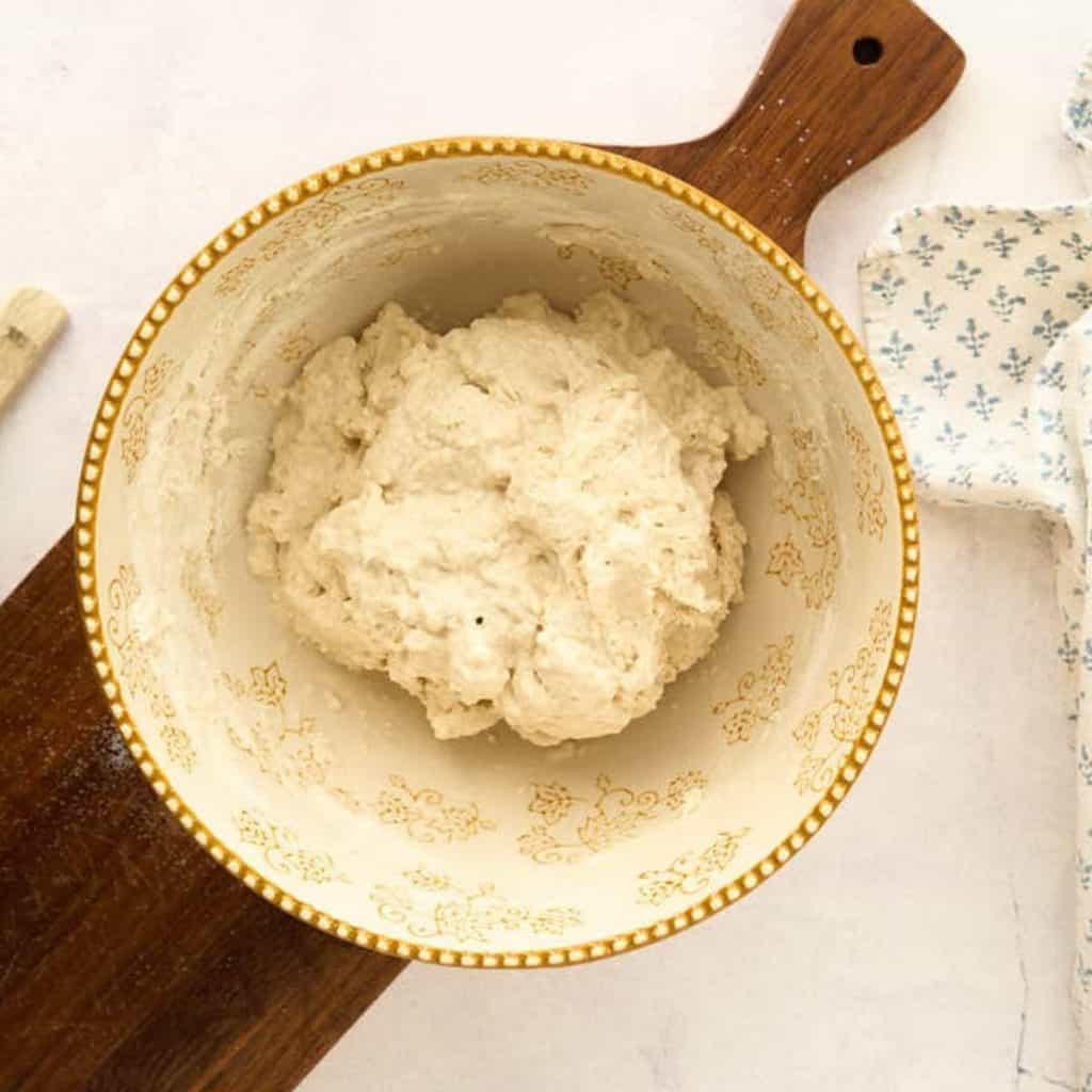 shaggy looking dough in mixing bowl