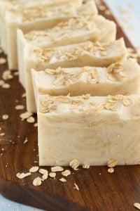 6 bars of light tan soap with oats on top