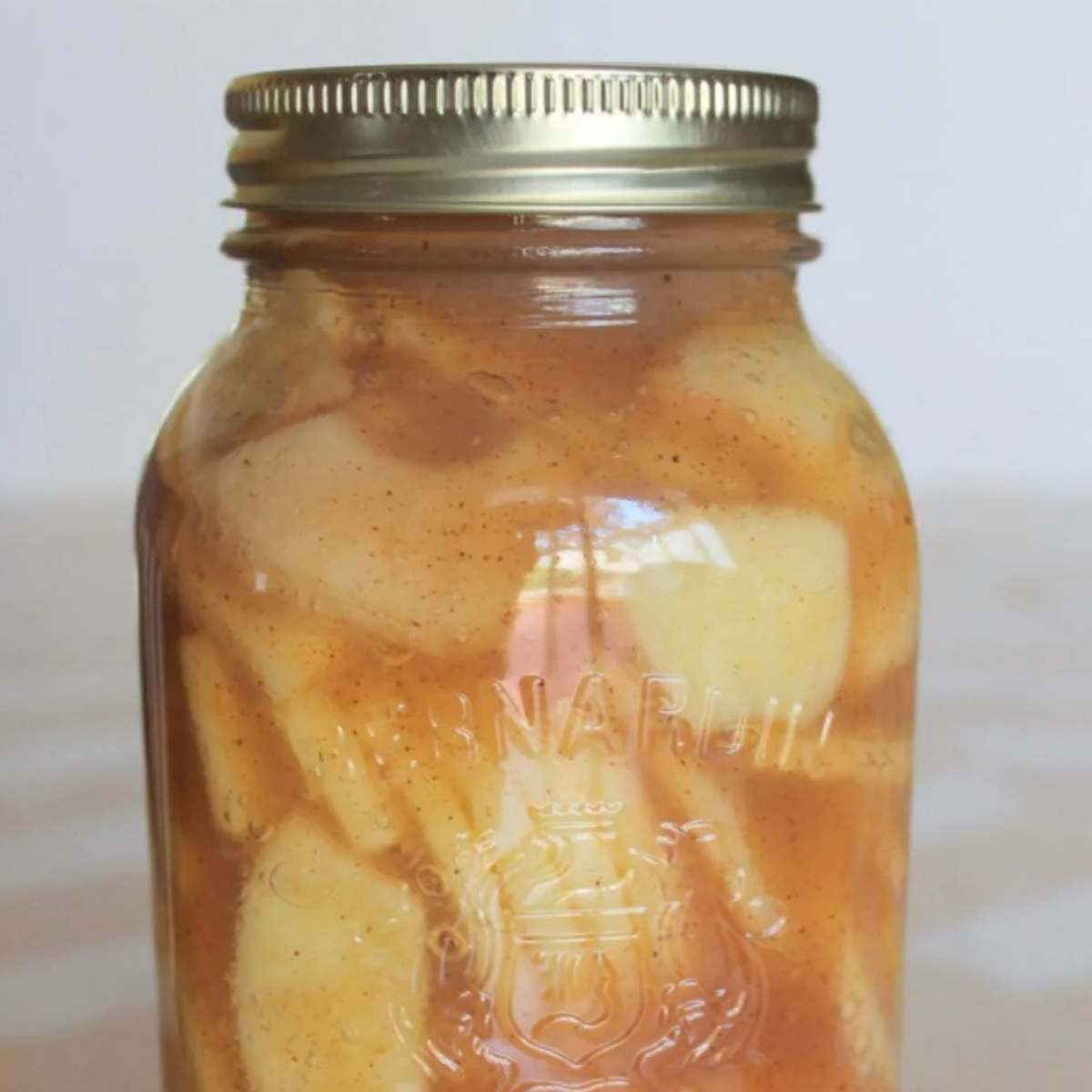 quart mason jar of spiced canned apples