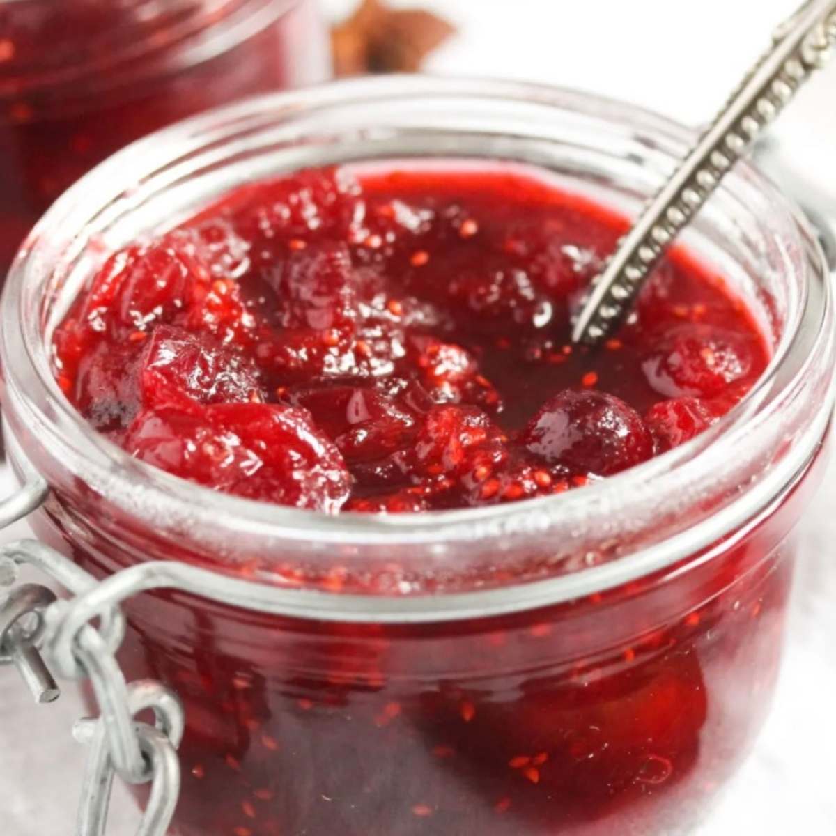 bright homemade cranberry sauce in small jar