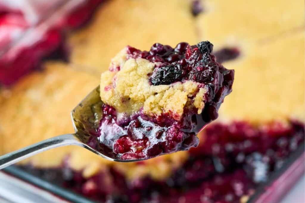 close up scoop of baked cobbler