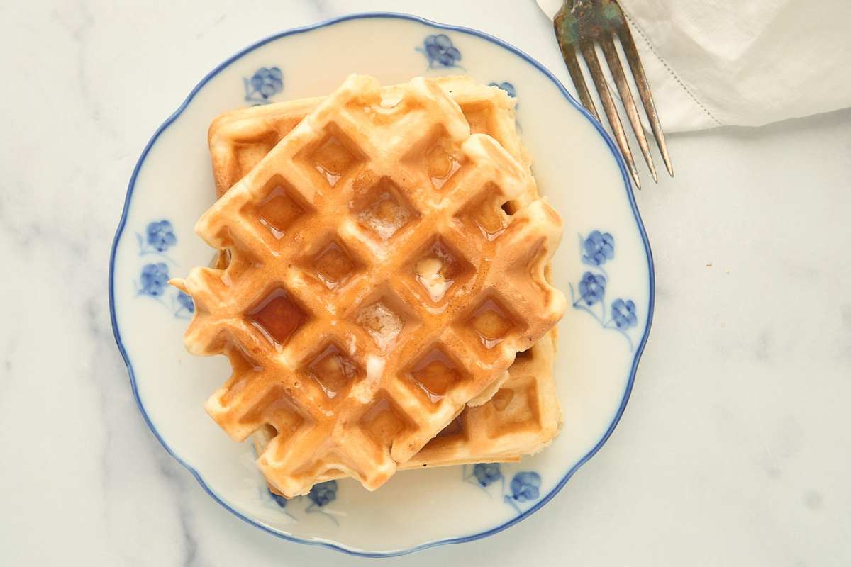 finished waffles on blue and white plate.