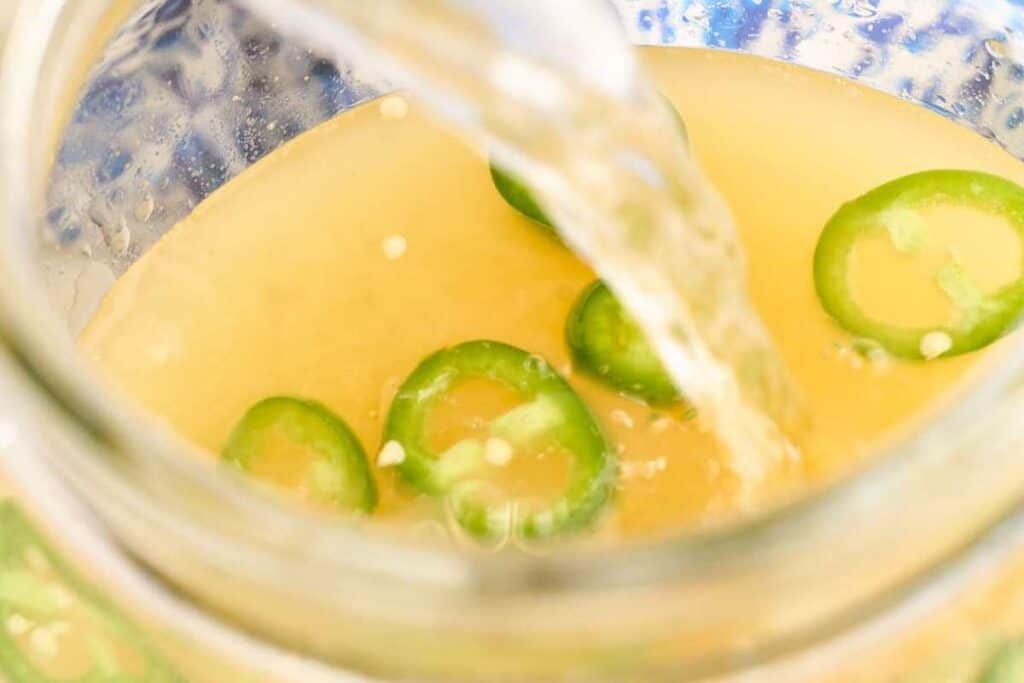 pouring club soda into pitcher