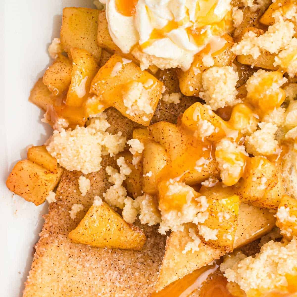 close up view of cinnamon apples topped with caramel