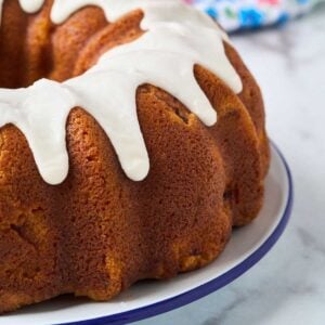browned bundt cake with thick white icing